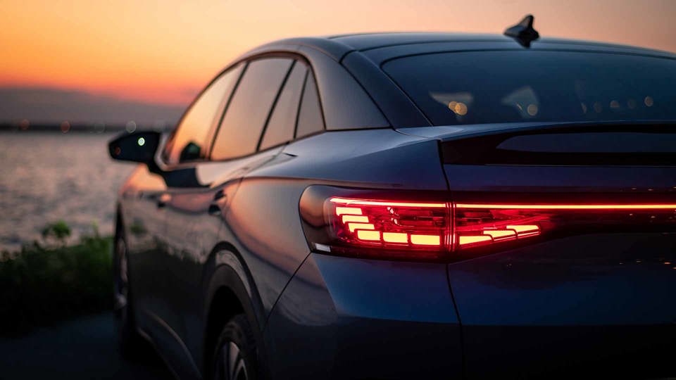 Blue Car Watching Sunset