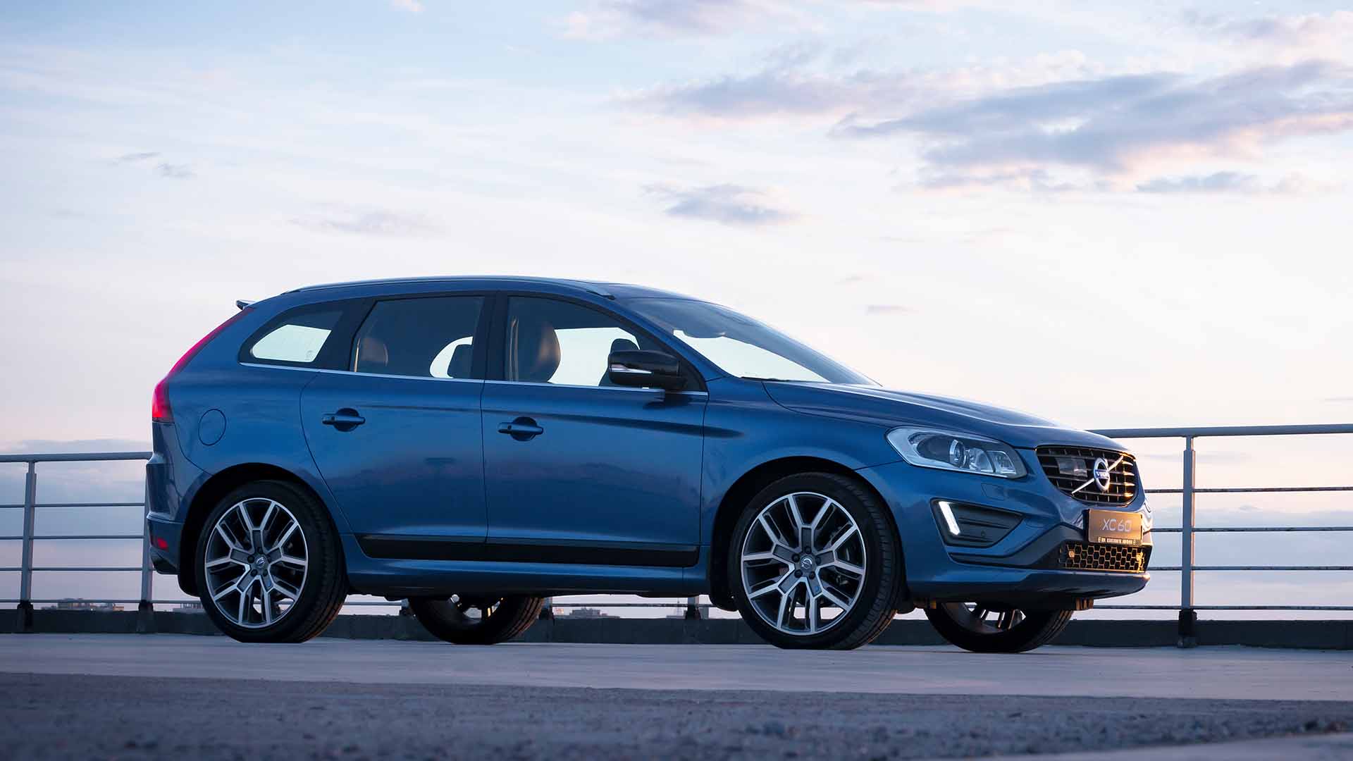 blue volvo sunset