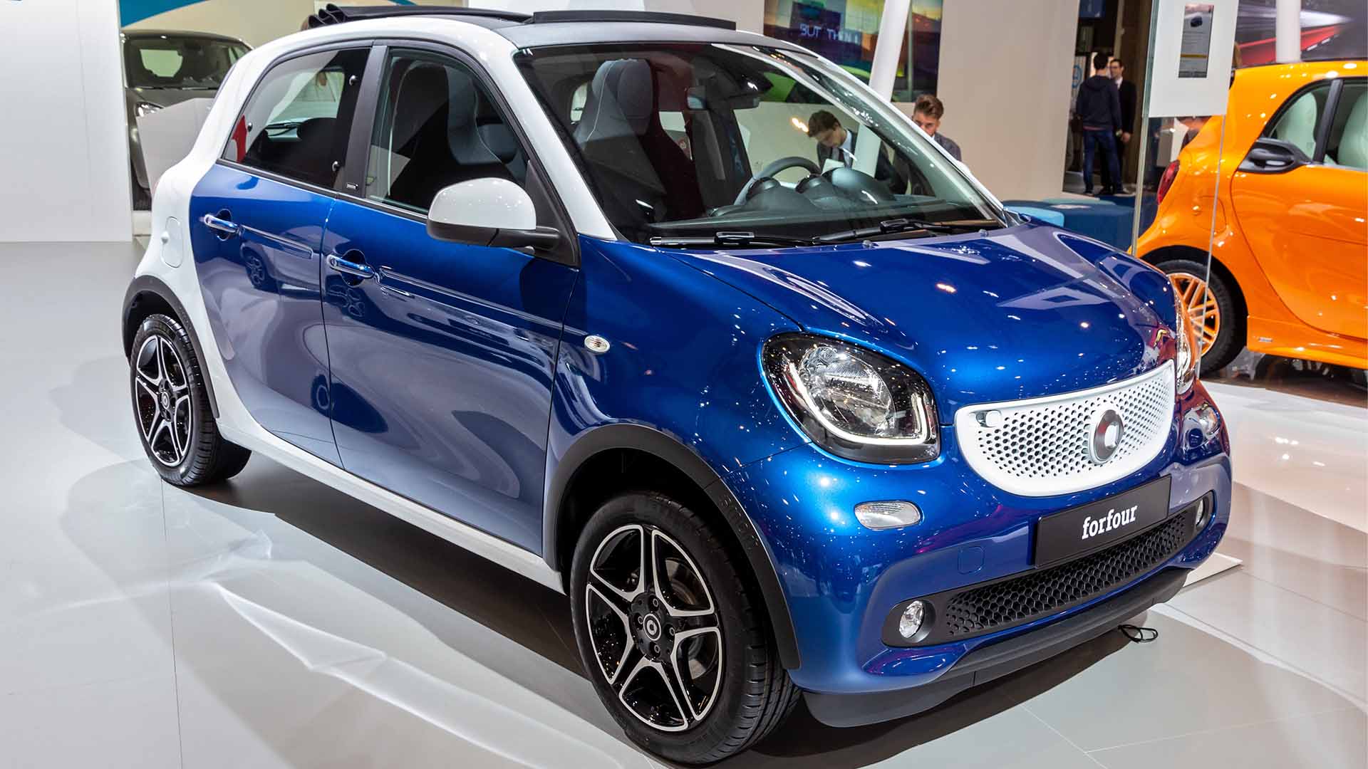 Blue and white SMART forFour in a showroom