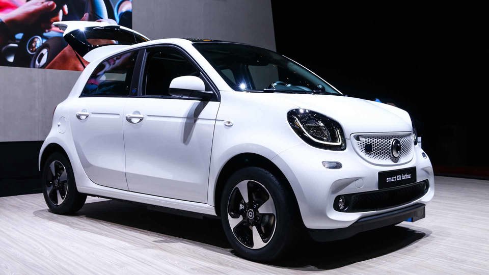 White SMART ForFour in a showroom