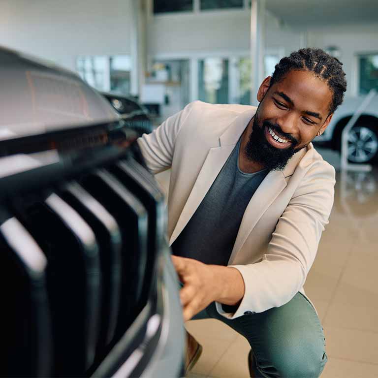 Man Admiring Car Bonnet