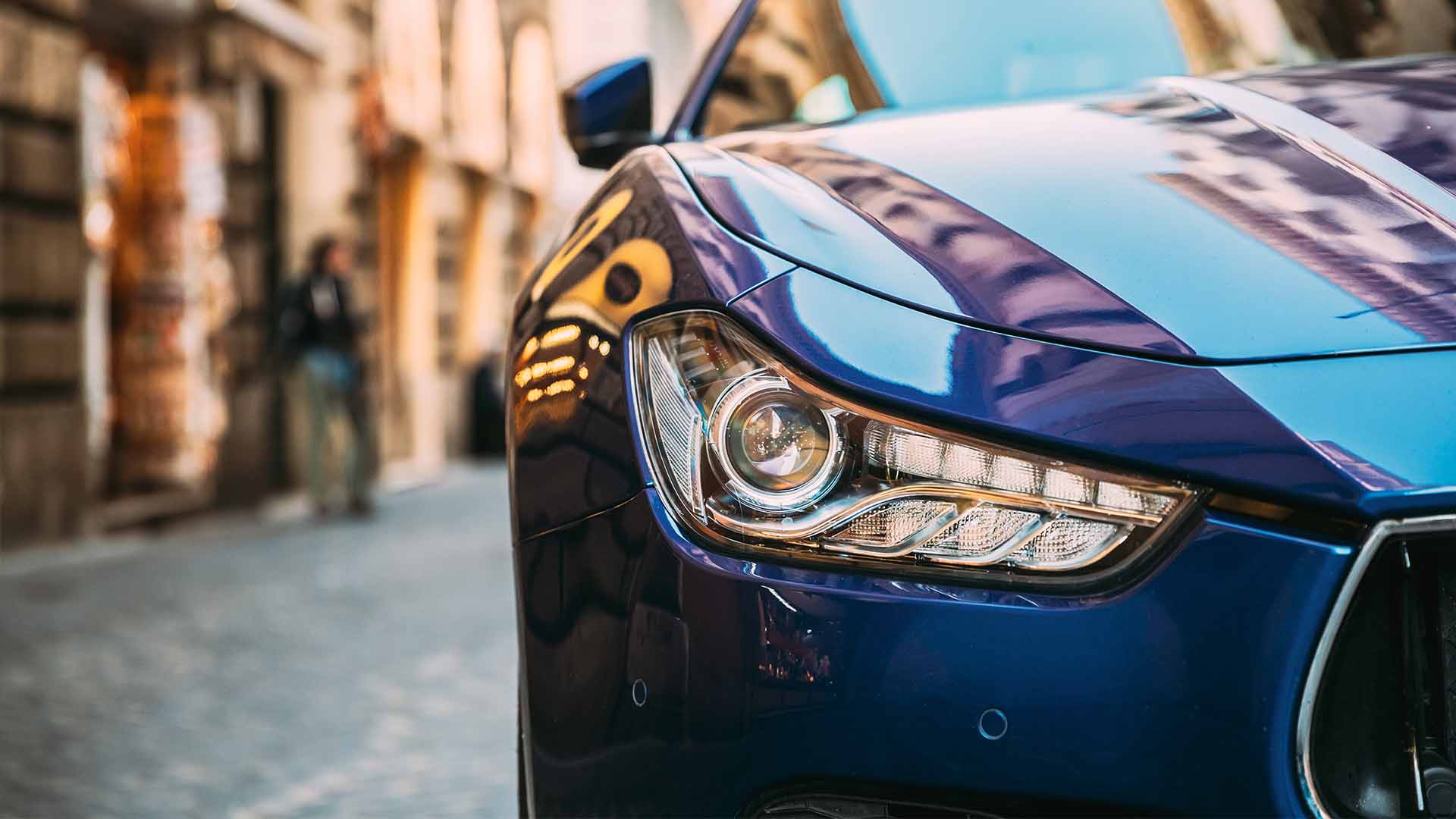 Front left light of a blue Mazda
