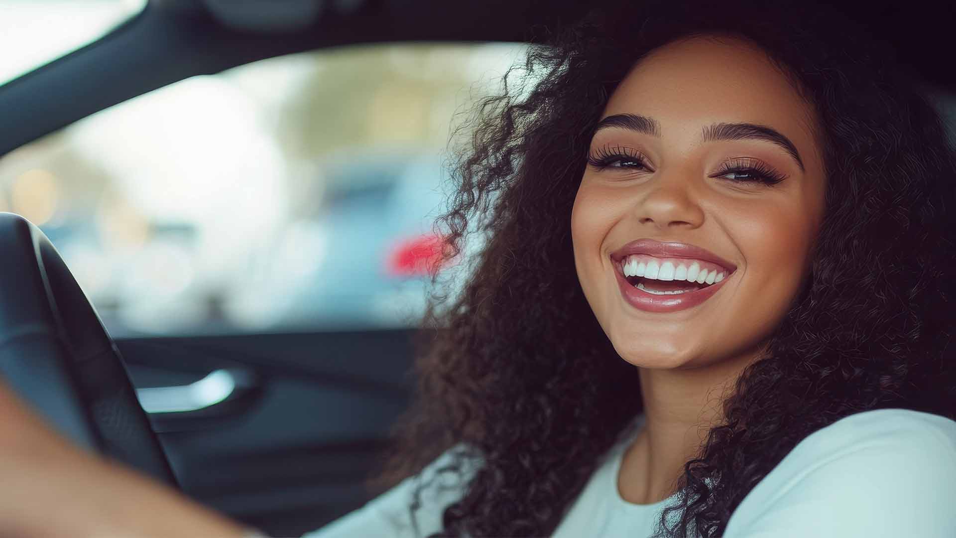 Woman smiling looking out of the car window