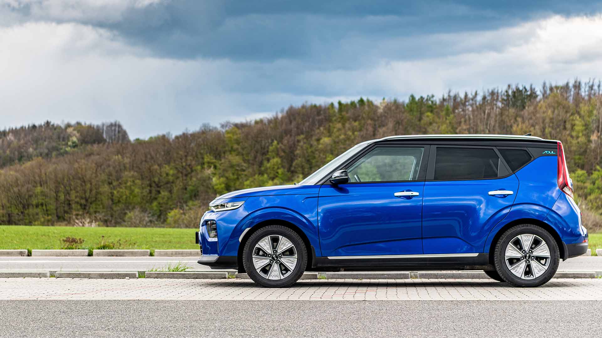 Blue Kia Soul at a park