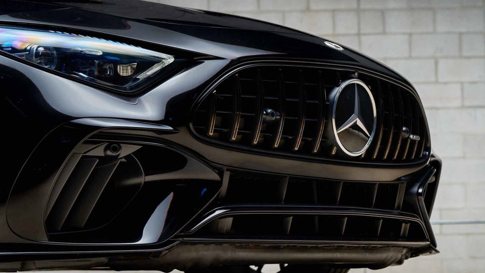 Front of a Black Mercedes-AMG with the logo