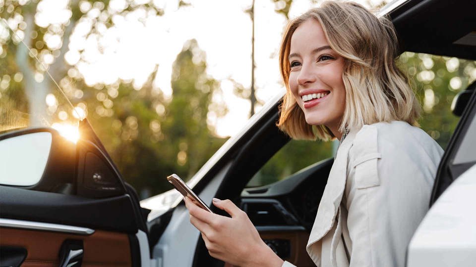Happy Blonde Womnan With Keys