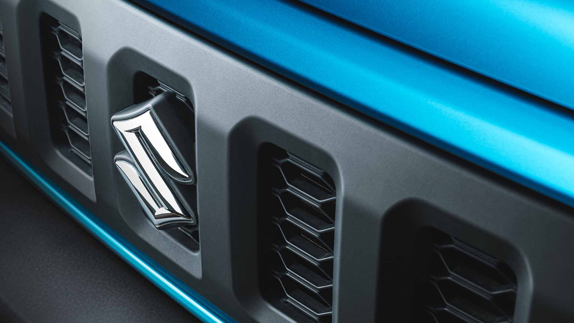 Badge of a blue Suzuki